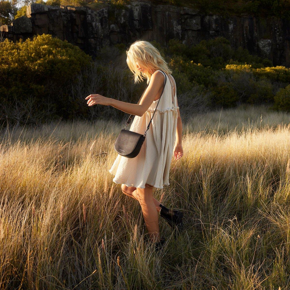 Status Anxiety art of pretending leather bag black