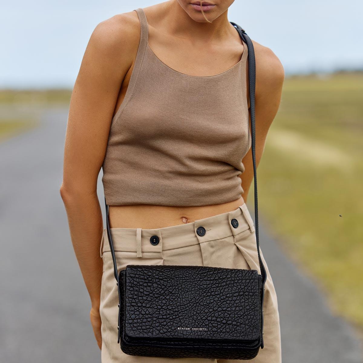Status Anxiety succumb leather bag black