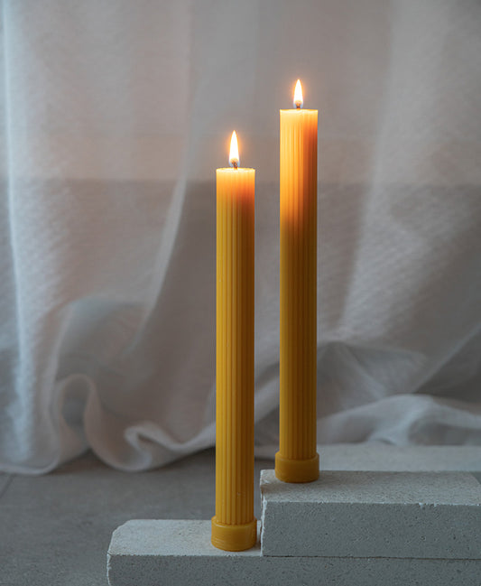 Ridged column beeswax candle with base