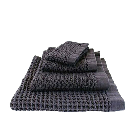 The Brera towel range has a luxurious large waffle weave that adds a textural dimension to your bathroom space.  Beautifully soft, Kontex Japanese towels are woven at gentle speeds on an old fashioned weaving machine. Kontex towels are highly absorbent, lightweight, fast-drying and environmentally friendly.  Made from 100% cotton.  Colour: navy  Dimensions Hand towel: 38cm wide x 85cm long  Face cloth: 36cm square