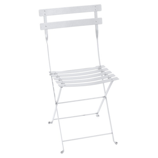 Classic outdoor folding bistro chair, made in France by the iconic French brand, Fermob.  The Bistro chair is designed to remain outdoors and is fully weather resistant. The chairs look great sitting around a small bistro table on a terrace or used them down a long banquet table under the vines! Dimensions: 38cm wide x 82cm high x 42cm deep  Colour: white