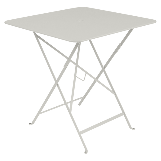 Classic outdoor folding bistro table with softened square edges, made in France by the iconic French brand, Fermob.  The Bistro table is designed to remain outdoors and is fully weather resistant.  Contemporary and compact the square table looks great paired with matching Bistro folding chairs.   Lending itself to more angular environments - be that a balcony, front porch or small deck,