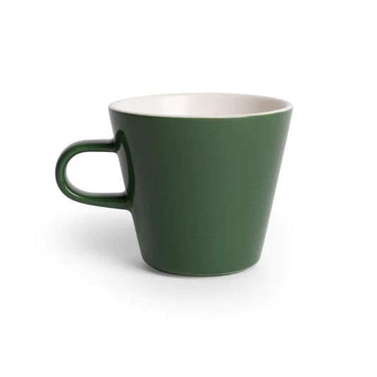 A fine, light cup, created by Acme. Ideal for tea and black coffee drinkers alike, this cup is made from magnesium porcelain, giving these cups a similar feel to bone china, while still remaining durable.   Dimensions: 7.6cm high x 8.9cm diameter, base diameter 4.9cm  Capacity: 270mls  Colour: kawakawa (green)  Dishwasher safe.