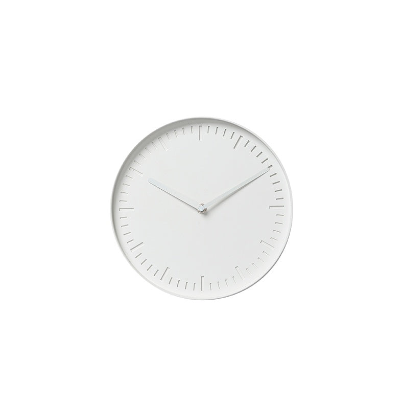 This stylish wall clock is sure to add functional design, with its contemporary aesthetic and laser cut time increments which create subtle shadowing. The clock is made from steel with a silent movement. Dimensions: 25cm diameter x 3.5cm high Colour: white