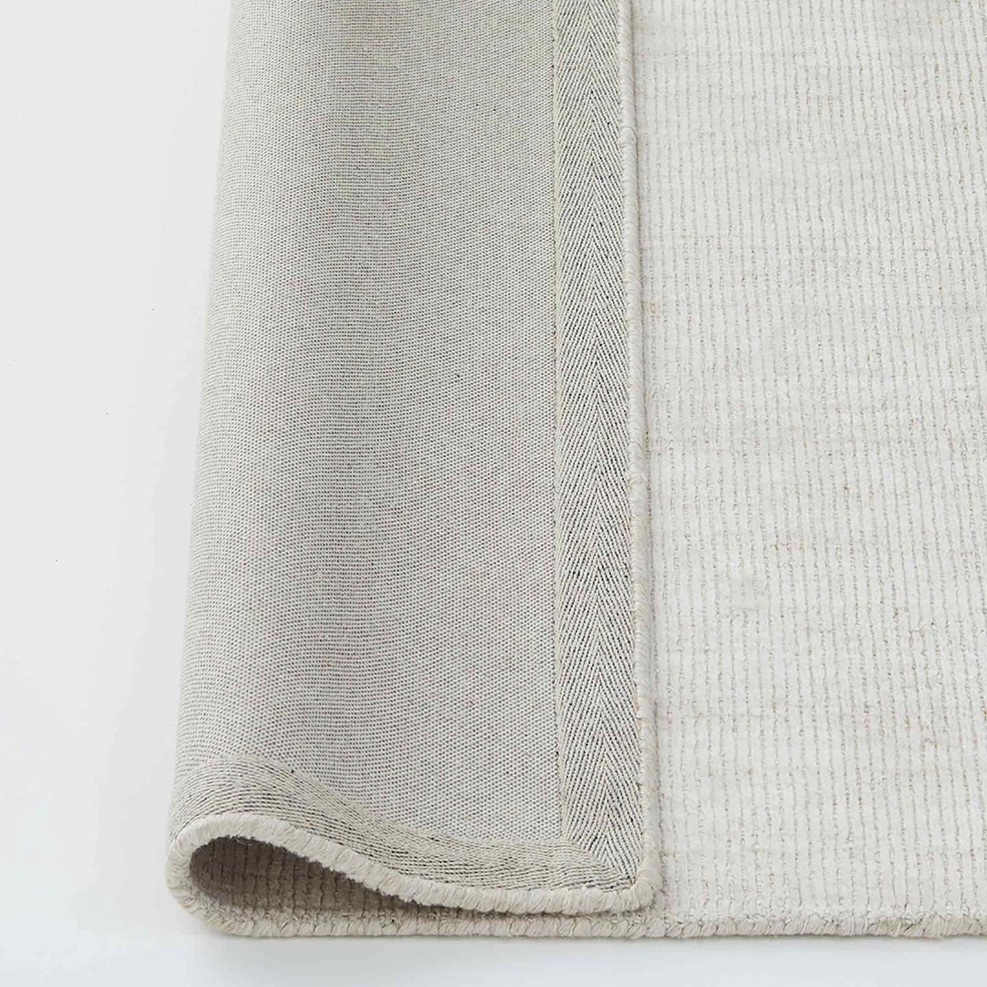 Travertine wool rug buff