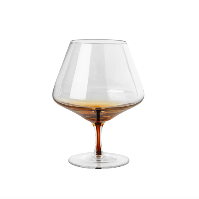 Serve drinks in the beautiful amber cognac glass from the Danish brand, Broste Copenhagen. This glass has a rich golden colour, inspired by amber, which makes the glass shine in warm honey tones. Dimensions: 11cm diameter x 15cm high