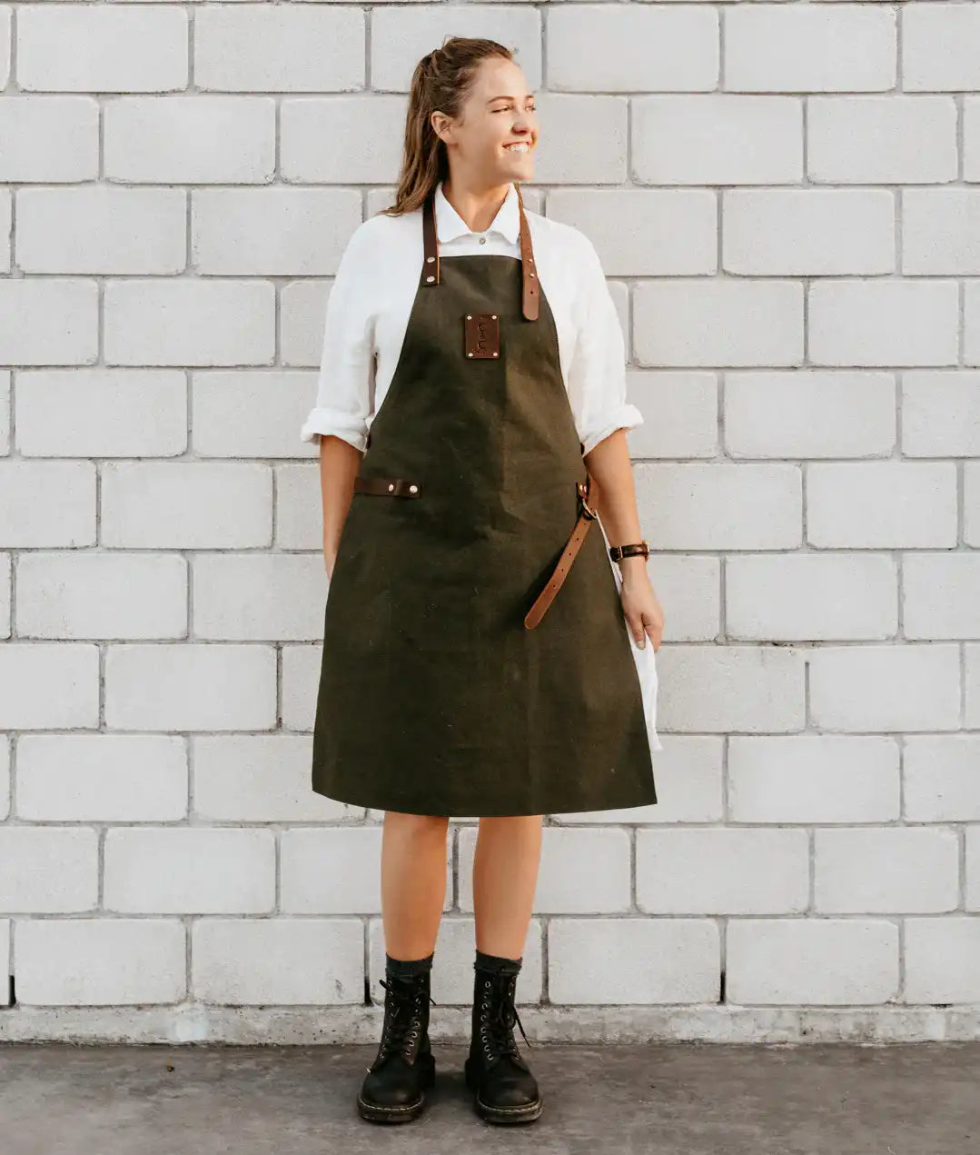 Olive canvas apron with brown leather trim