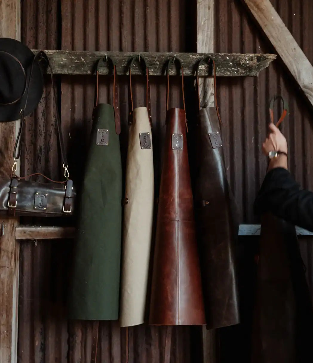 Olive canvas apron with brown leather trim