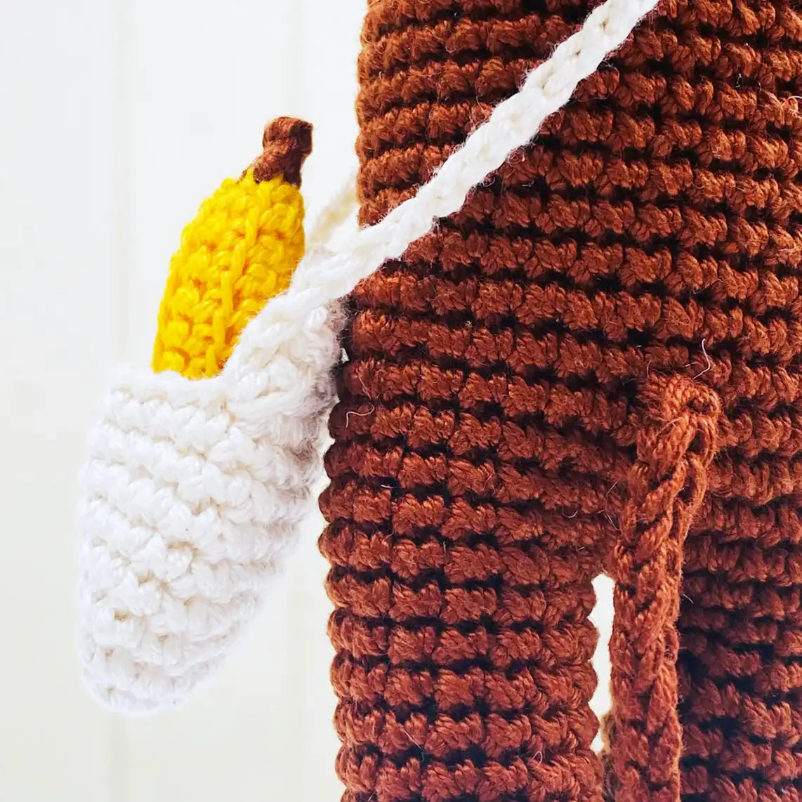 Fairtrade knit monkey toy with banana