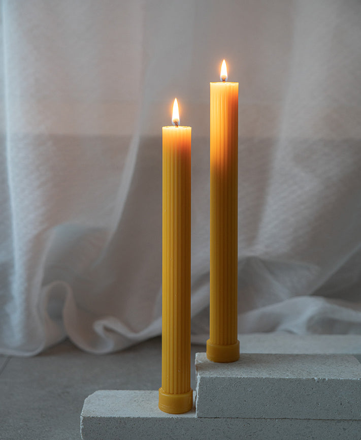 Ridged column beeswax candle with base