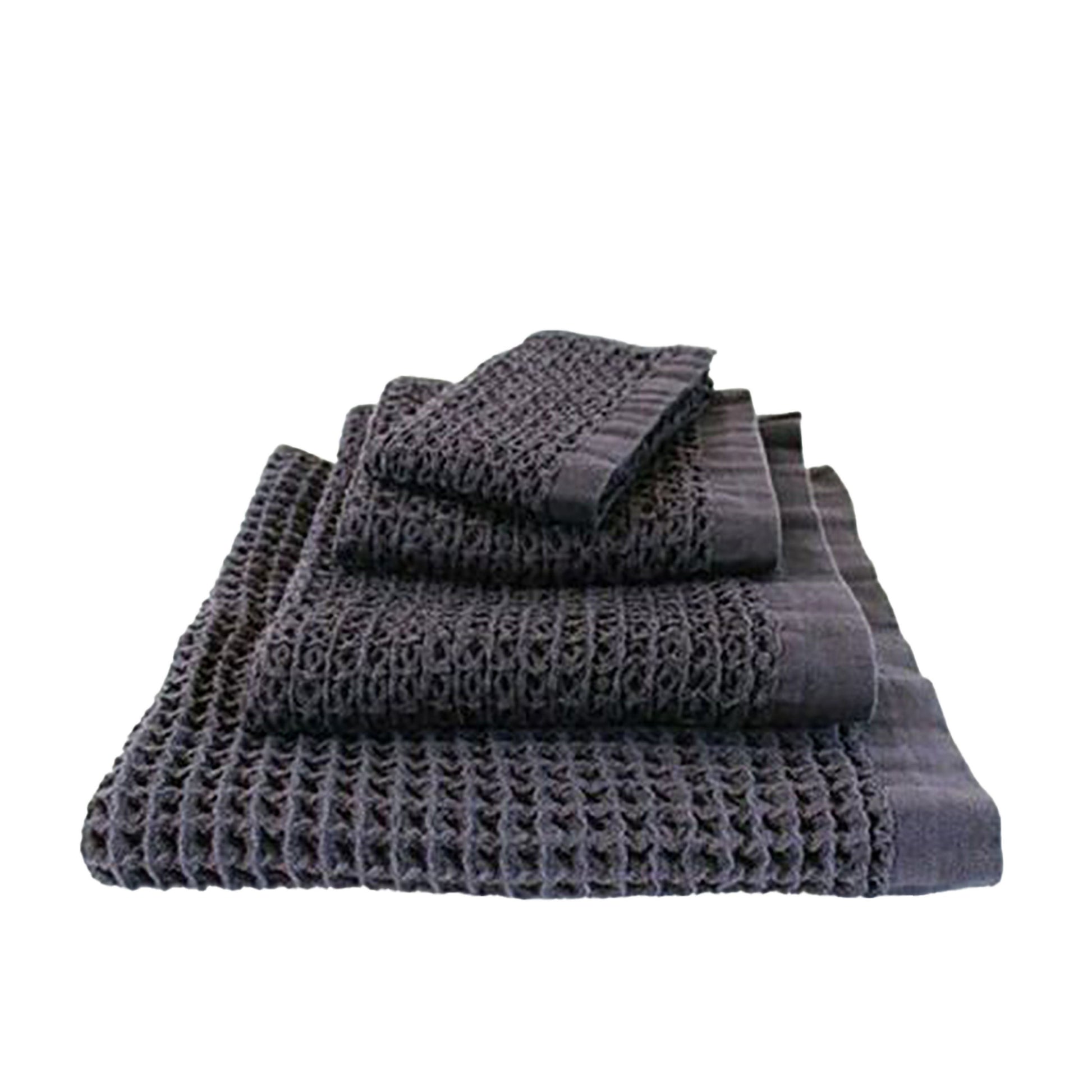 The Brera towel range has a luxurious large waffle weave that adds a textural dimension to your bathroom space.  Beautifully soft, Kontex Japanese towels are woven at gentle speeds on an old fashioned weaving machine. Kontex towels are highly absorbent, lightweight, fast-drying and environmentally friendly.  Made from 100% cotton.  Colour: navy  Dimensions Hand towel: 38cm wide x 85cm long  Face cloth: 36cm square 