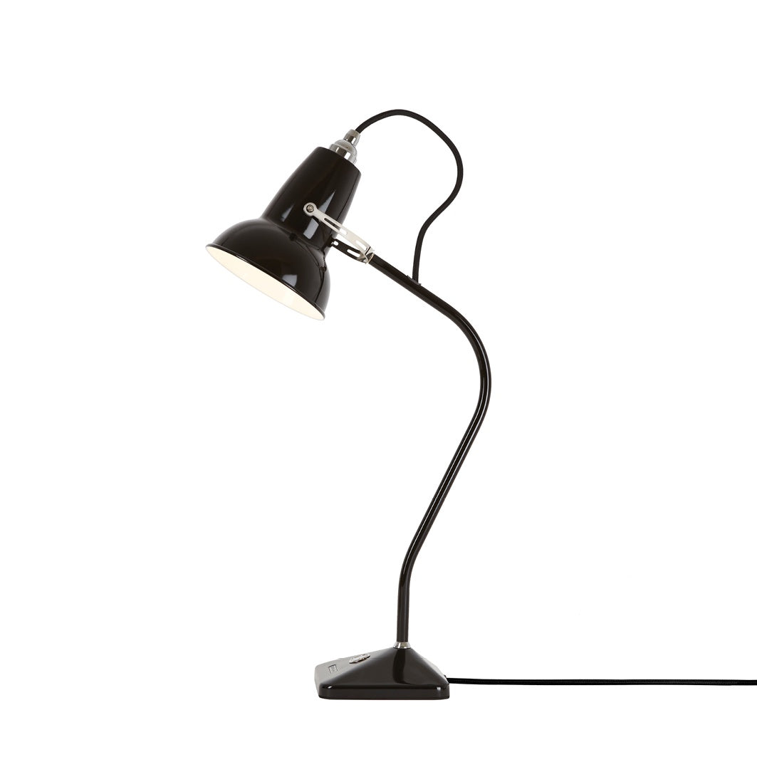 Turn on the light, and the quintessentially British charm - all in the flick of a switch with the Original  1227 Angelpoise mini table lamp.  Colour: jet black  This iconic Anglepoise Lamp's perfectly balanced modernist form, and cheeky anthropomorphic demeanour will brighten your mood, and light up your home.   The handy, easy-access power switch makes the lamp a perfect bedside light.