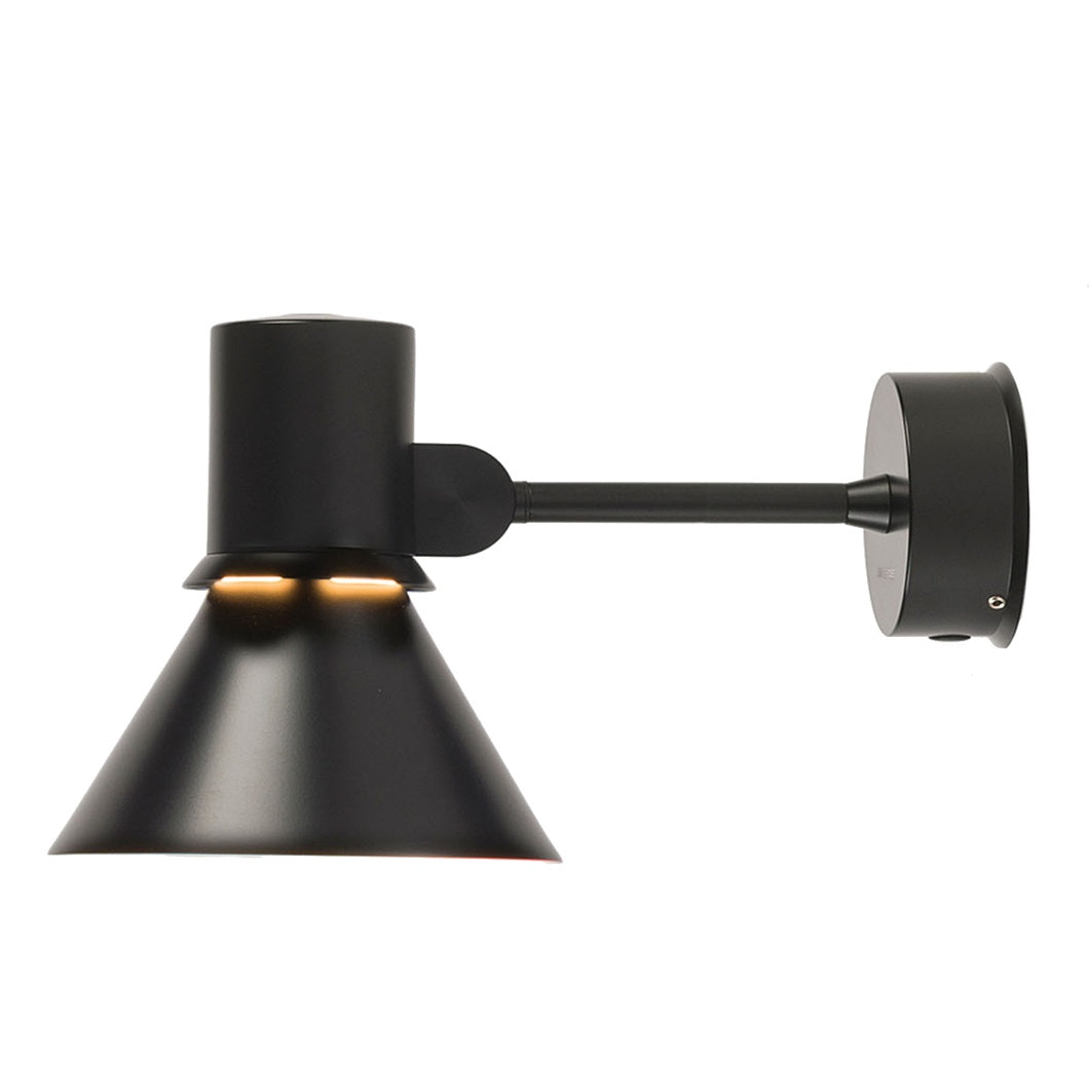 The Type 80 wall light by Anglepoise boasts a contemporary, graphic design. The statement light is defined by its attractive ‘halo’ light-escape in the light shade. Every detail is carefully considered with cables discreetly routed through the arm with an accessible power switch.  Designed in collaboration with renowned industrial designer Sir Kenneth Grange.  Colour: matte black   Dimensions: 26.5cm deep x 14cm diameter x 16cm high