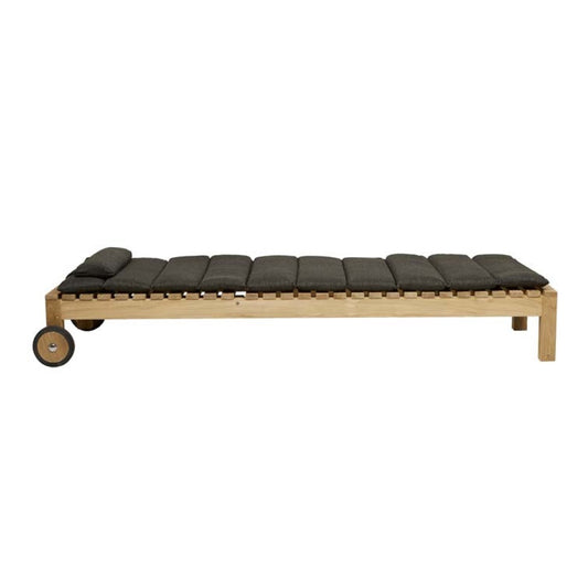 Teak outdoor lounger with tufted squab ink