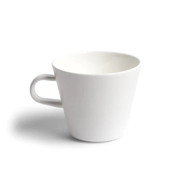 A fine, light cup, created by Acme. Ideal for tea and black coffee drinkers alike, this cup is made from magnesium porcelain, giving these cups a similar feel to bone china, while still remaining durable.  Dimensions: 8.9cm diameter x 7.6cm high   Capacity: 270mls  Colour: white  Dishwasher safe.