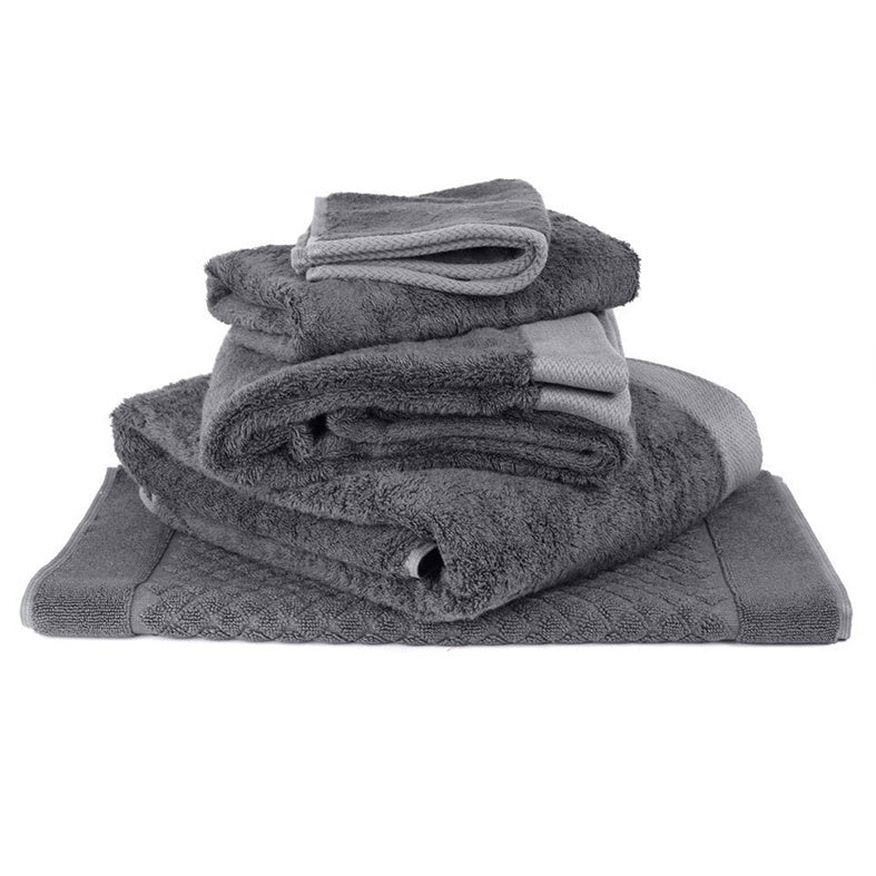 Enjoy this soft silky feel range of finely woven towels made from a luxurious cotton and bamboo blend.  Bamboo’s natural anti-bacterial properties and softness mean these towels are great for sensitive skin.  Made of 60% cotton and 40% bamboo.   Colour:  charcoal  Full range available: Bath towel  147cm x 70cm Hand towel  76cm x 45cm Bath mat  49cm x 78cm Face cloth  34cm square