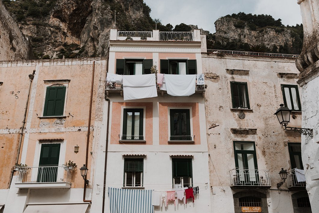 ‘Laundry Day’ was taken by NZ photographer Brijana Cato. Brijana took the photo  of the pink balconies in Atrani, on the Amalfi Coast.  Brijana grew up in a small beach town north of Auckland, and she is hugely inspired by the ocean, coastline and anywhere warm and tropical. She is known for her fashion work with NZ fashion brands, often traveling around NZ and abroad.